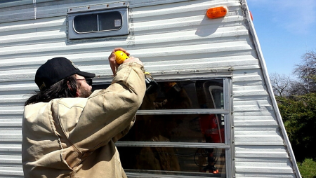 Weatherproofing front window.